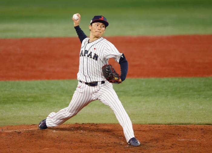 Team Japan pitcher Yoshinobu Yamamoto throws a pitch against Korea in a baseball semifinal match during the Tokyo 2020 Olympic Summer Games at Yokohama Baseball Stadium. (2021)